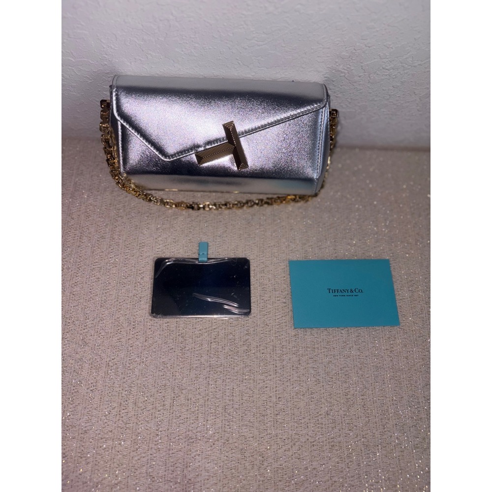 Tiffany & Co Tiffany T Clutch on a Chain Silver new Lambskin Leather Gold tone